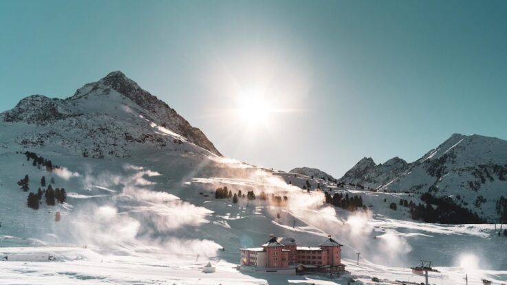 brown building on snow field during daytime